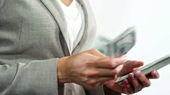 Rich Businesswoman Counting Money alt