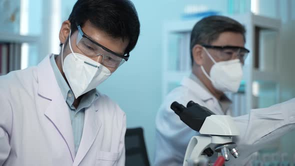 doctor scientist has researching a vaccine in the laboratory, meeting and writing analysis results alt