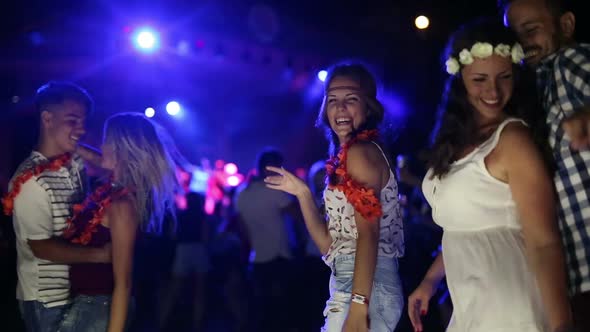 Group of Friends Having Fun and Dancing at Concert