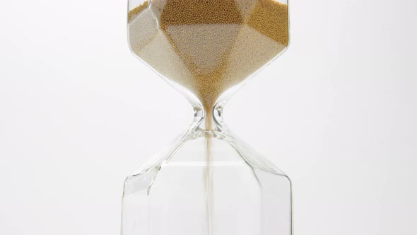 Closeup of a Sand Clock in the Middle of the Frame