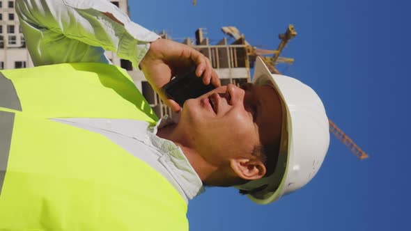 Vertical Screen Building Inspector at Work on Construction Site alt