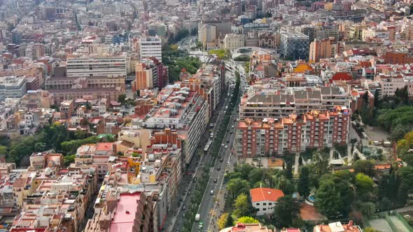 Aerial drone view of Barcelona, Spain. Blocks with multiple residential buildings, roads with cars a alt