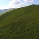 Aerial flight over green hill mountains. FPV Dynamic drone shot - VideoHive Item for Sale