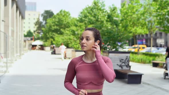 Young Active Motivated Fit Woman Runner Jogger Running in Urban City Park alt