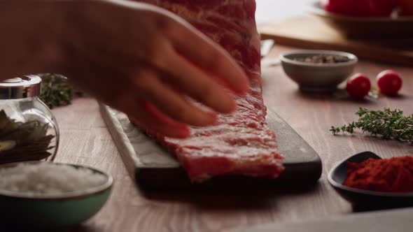 Woman Chef Cooking Ribs Closeup alt