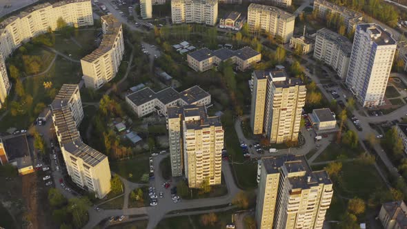 An Aerial View of the Construction of a House Next To the Built Houses.