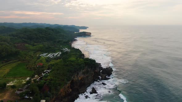 Aerial view on cliffs on southern shore of Java Island, Indonesia at sunset alt