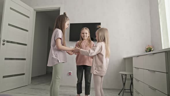 Little girls playing clapping game together