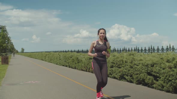 Sporty Female Runner Meeting Friend in City Park alt