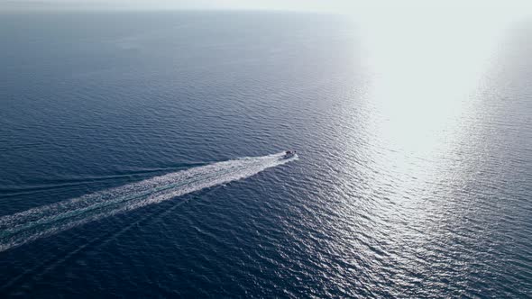 Drone  Footage of the Motor Boat Sailing in the Open Sea in the Sunny Day