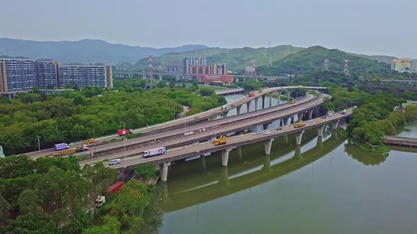 A dynamic aerial shot moving towards a highway above waters in Yuen Long in Hong Kong. Yuen Long Hig alt