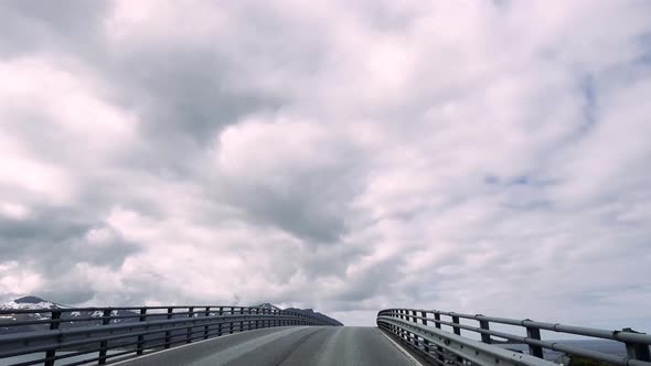 Driving a Car on a Road in Norway Atlantic Ocean alt