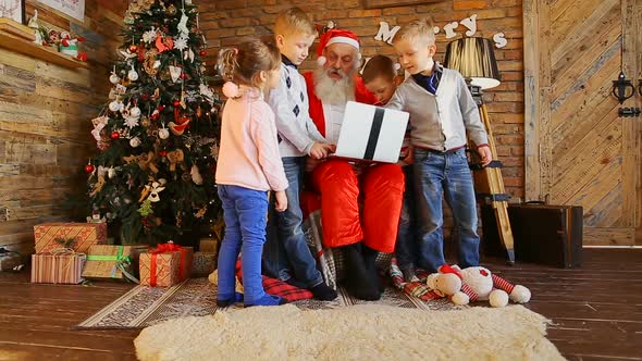Santa Writes Children's Wishes on Laptop.