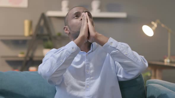 Portrait of Hopeful African Man Praying alt