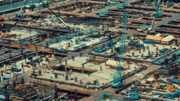 Time lapse of construction site with heavy construction machinery in metropolis alt