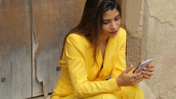 Young beautiful girl with smartphone