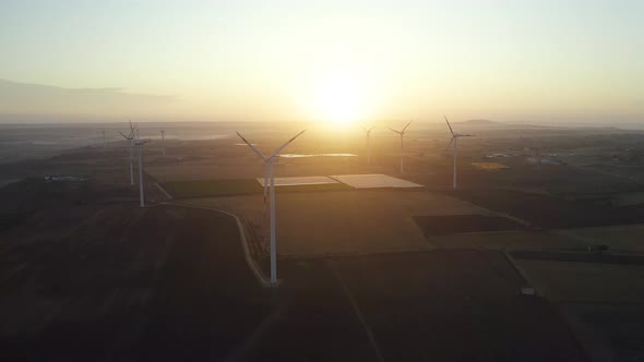 Aerial view of Wind turbines at sunrise