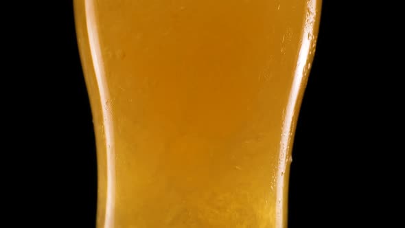 Slow Motion Detail Shot of Beer Bubbles in Glass