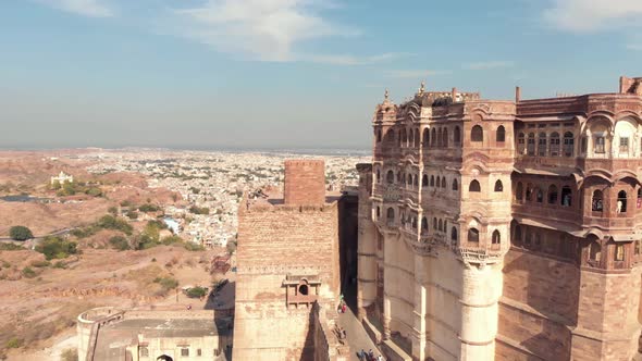 view of Mehrangarh Fort's facades overlooking the terraces and features surrounded by prey birds alt