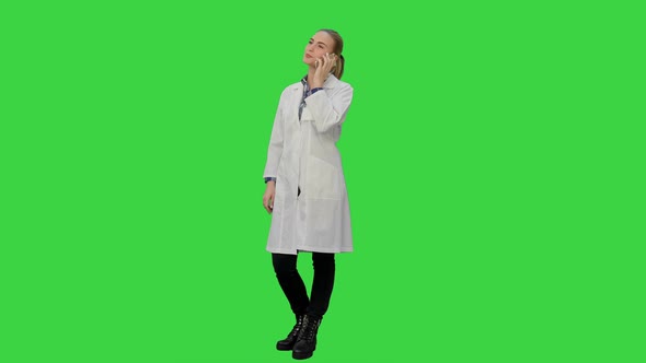 Female Doctor Talk Via Cell Phone with Patient Reporting Good News on a Green Screen, Chroma Key alt