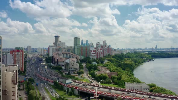 Aerial Drone Zoom in of Moscow Suburban Panorama Under Cloudy Sky alt
