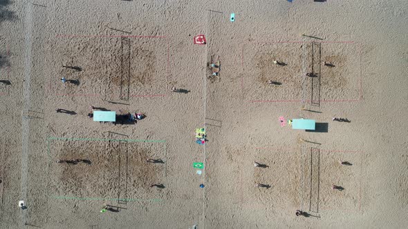 Top View of a Group of Friends Playing Beach Volleyball on the Beach
