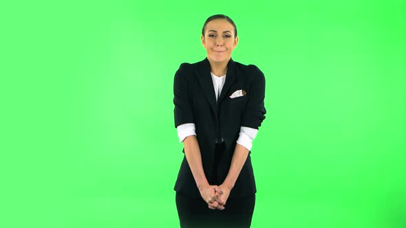 Woman Disappointed Looks in Camera Bites Her Lip Then Shrugs. Green Screen alt