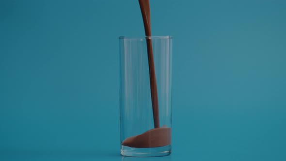 Super Slow Motion of Pouring Chocolate in Transparent Glass at 1000 Fps alt