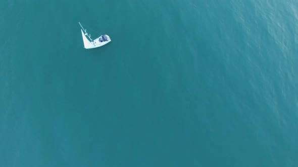 Small Sailing Boat Peacefully Floating on Blue Water, Freedom, Independence alt