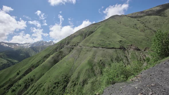Caucasus Mountains with Peaks and Ridges Covered with Snow Rocks and Cliffs alt