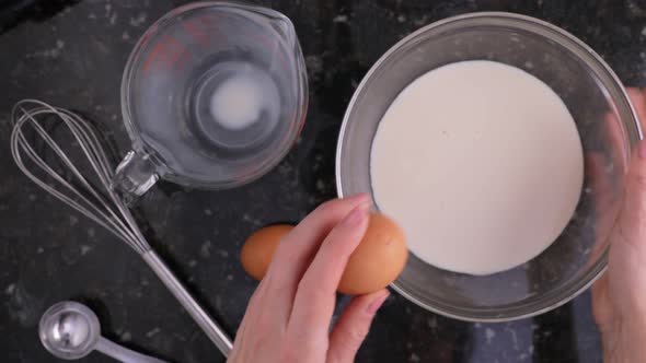 Cracking Egg Into Bowl