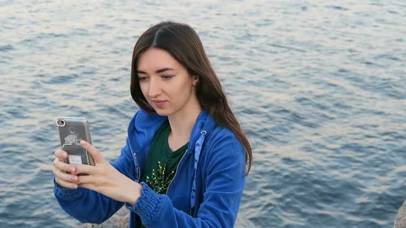 Girl Makes Selfie On The Background Of The Sea 3 alt