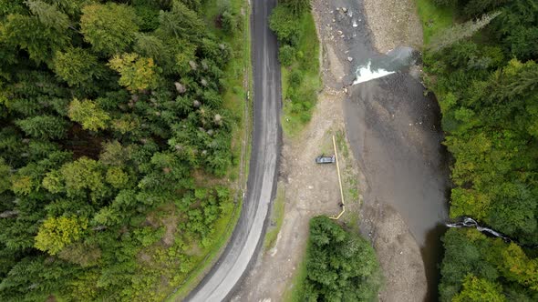 Aerial View of Road in Carpathian Mountains Near River alt