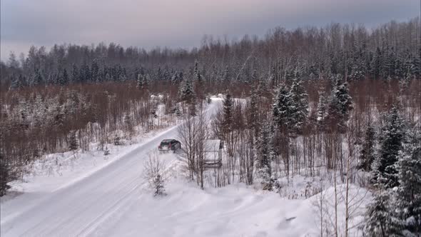 Volvo v90 cross country car is driving on the snow road