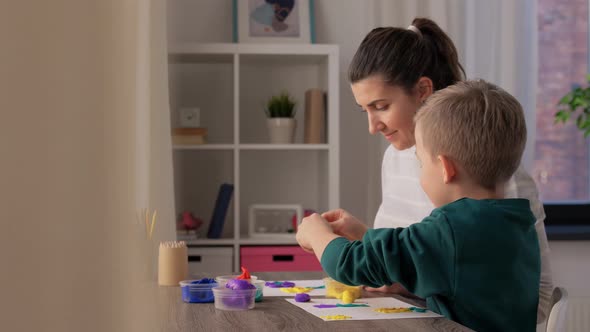 Mother and Son Playing Modeling Clay at Home alt