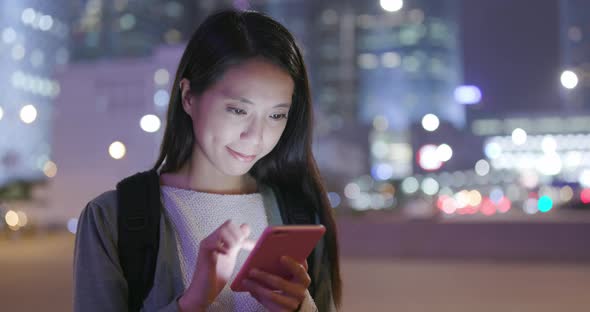 Woman look at cellphone alt