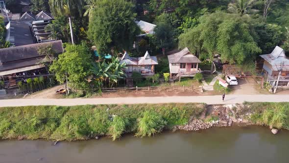 Aerial Of Tropical Mountain Riverfront Town alt