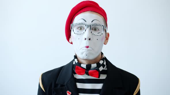 Portrait of Comic Actor in Costume Making Funny Grimaces Looking at Camera alt