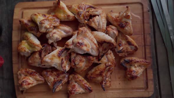 Freshly Cooked Smoked Chicken Wings on Wooden Platter