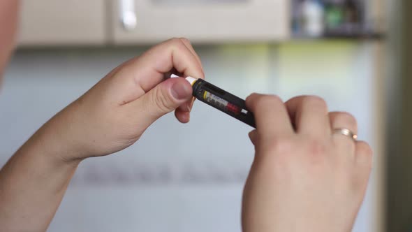 Girl Puts a Needle Insulin Syringe Pen alt