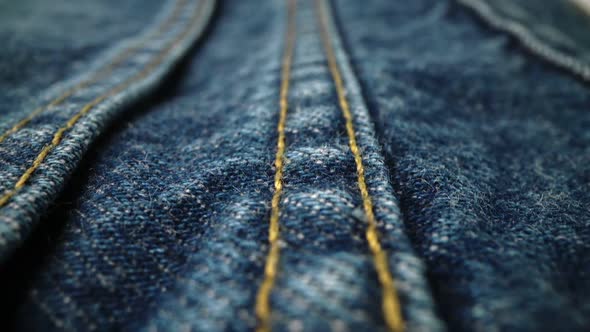 Extreme Detailed of Blue Denim Jeans Texture in Dolly Shot Over Cloth Surface alt
