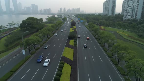 Aerial View of Cars Running on the City Road at Sunset China alt