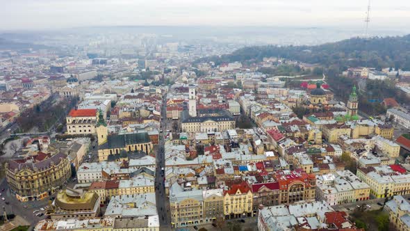 Aerial Hyperlapse Time Lapse, Flight Above the Roofs on Sunset. Old European City. Ukraine Lviv