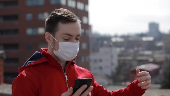 Couple in Surgical Masks Looking News About Covid-19 Virus alt