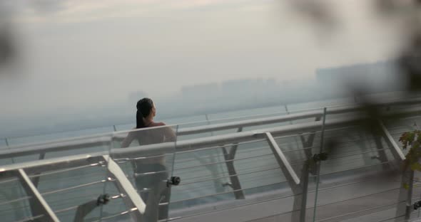 Strong Sportswoman Running Fast on Bridge