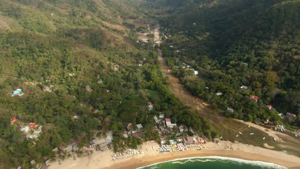 River Between The Green Mountains With Yelapa Beach Town And Boats In The Sea In Jalisco, Mexico. - alt
