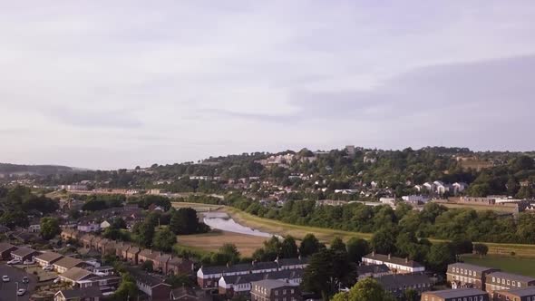 Beautiful aerial view of a local residential area in Exeter with a river flowing through. alt