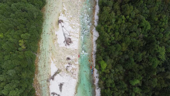 Aerial view of kayakers in the river Soca in Slovenia.