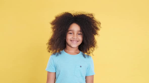 Cheerful Happy Small Girl with Dark Skin Smiling Laughing and Looking in Camera alt