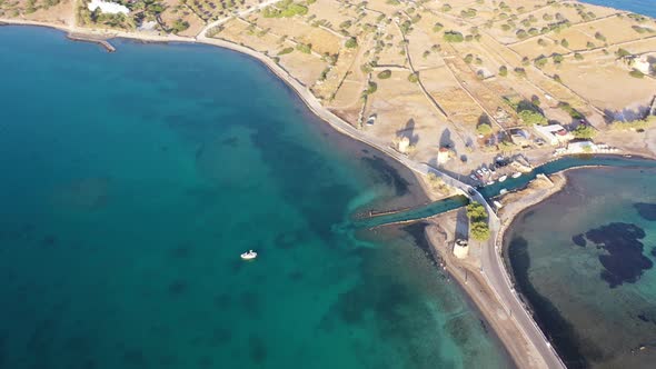 Aerial View of a Motor Boat in a Deep Blue Colored Sea. Kolokitha Island, Crete, Greece